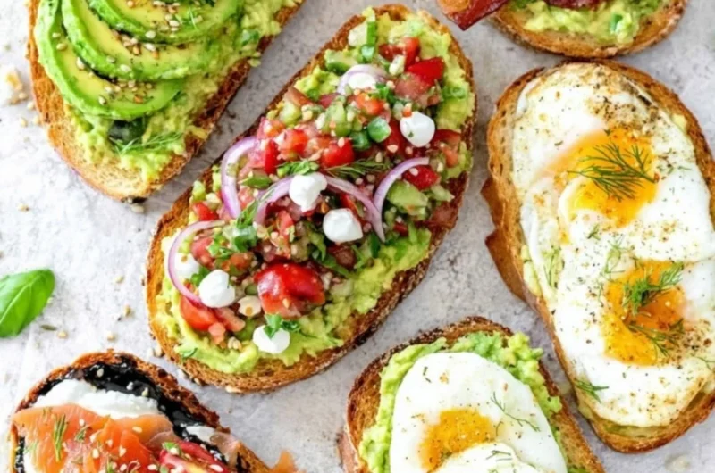 Delicious plate of avocado toast topped with tomatoes and herbs