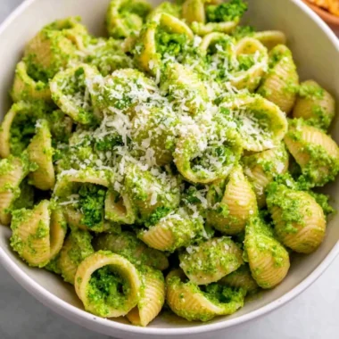 Delicious healthy broccoli pasta dish garnished with parmesan cheese