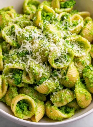 Delicious healthy broccoli pasta dish garnished with parmesan cheese