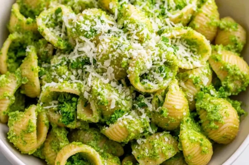 Delicious healthy broccoli pasta dish garnished with parmesan cheese