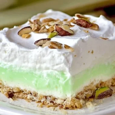 Deliciously creamy easy Pistachio Lush dessert served in a glass dish