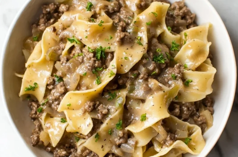 A delicious bowl of beef and noodles served with fresh herbs.