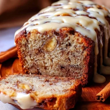 Freshly baked cinnamon roll banana bread with cinnamon swirl and glaze