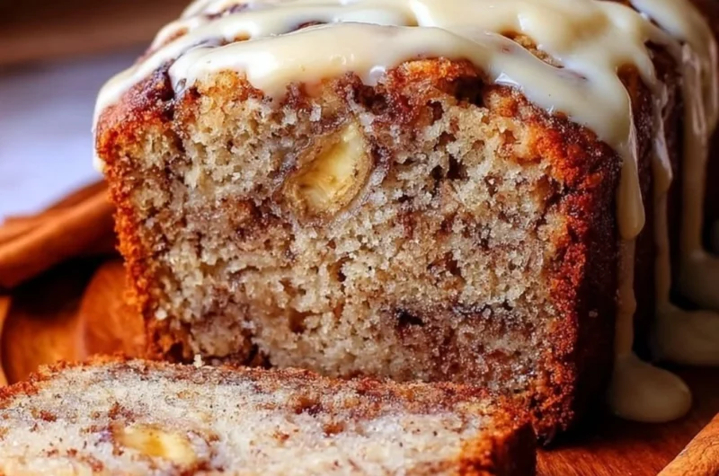 Freshly baked cinnamon roll banana bread with cinnamon swirl and glaze