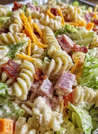 Colorful bowl of Club Sandwich Pasta Salad with creamy dressing and fresh ingredients