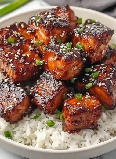 Honey Garlic Salmon Bites Bowl with vegetables and garnishes