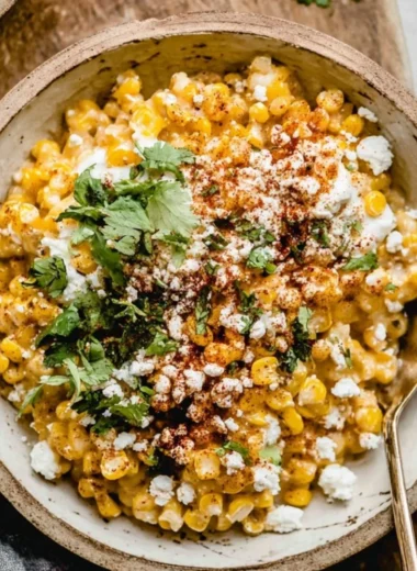 Delicious Mexican street corn casserole topped with cheese and cilantro