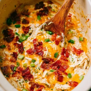 Slow Cooker Crack Chicken recipe in a bowl with toppings