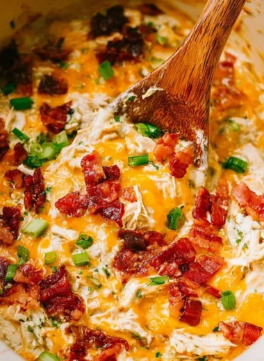 Slow Cooker Crack Chicken recipe in a bowl with toppings