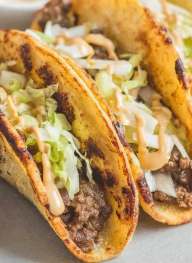Delicious Smash Burger Tacos with beef patty and fresh toppings in a tortilla