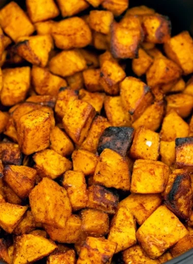 Crispy air fryer sweet potato cubes served in a bowl
