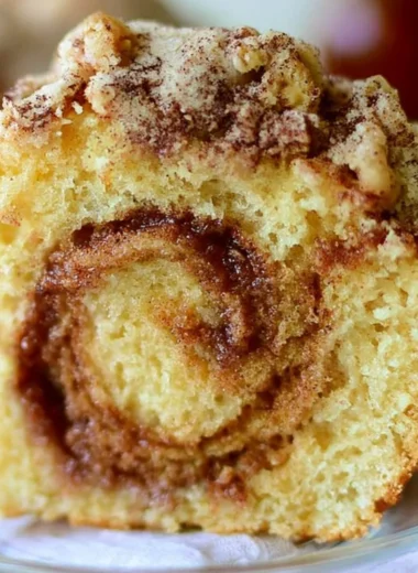 Moist cinnamon swirl coffee cake fresh out of the oven with a golden crust