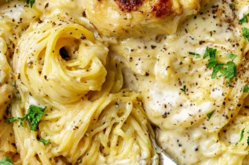 Delicious Crock Pot Angel Chicken served on a plate with herbs.