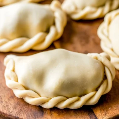 Homemade empanada dough ready for filling and baking.