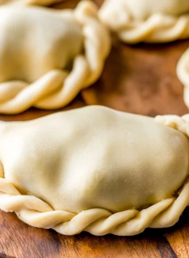 Homemade empanada dough ready for filling and baking.