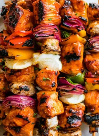 Grilled chicken kabobs with colorful vegetables on skewers.