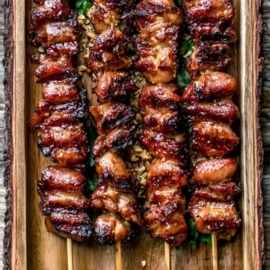 Grilled Thai coconut chicken skewers on a serving platter
