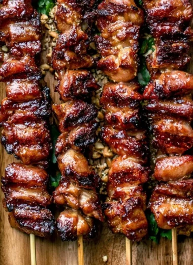 Grilled Thai coconut chicken skewers on a serving platter