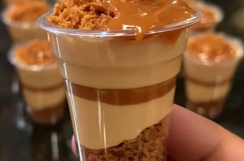 Mini Biscoff cheesecake cups topped with crushed Biscoff cookies