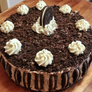 Oreo Easy Ice Cream Cake decorated with chocolate and whipped cream