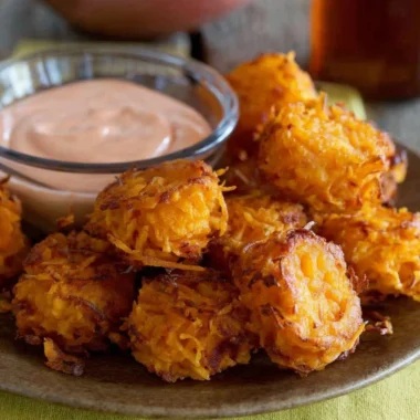 Crispy Sweet Potato Tots on a white plate, served with dipping sauce