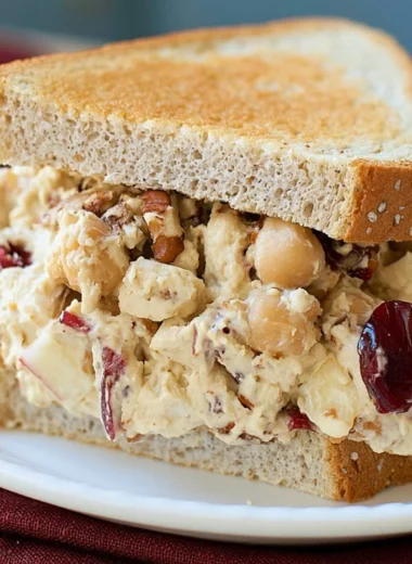 Apple pecan chickpea salad sandwich served on whole grain bread