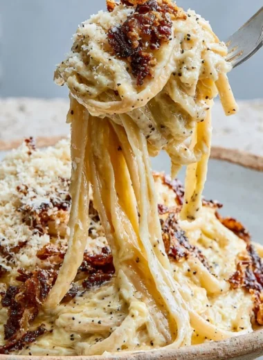 Delicious plate of authentic carbonara pasta with creamy sauce and pancetta