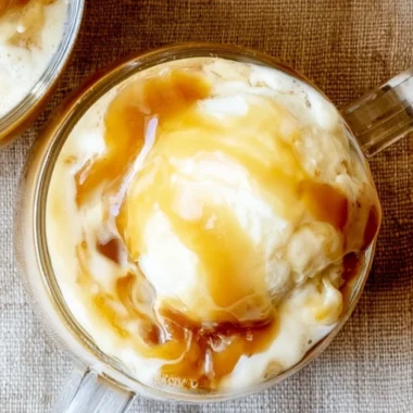 Delicious caramel apple cider float topped with whipped cream