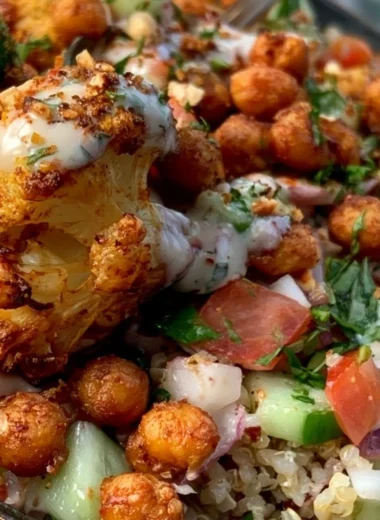 Delicious Cauliflower Shawarma Bowl topped with fresh vegetables and tahini sauce