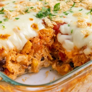 Delicious Cheesy Chicken Taco Casserole served in a bowl with toppings