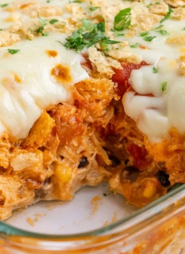 Delicious Cheesy Chicken Taco Casserole served in a bowl with toppings