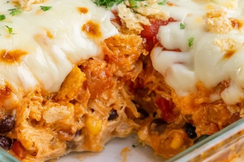 Delicious Cheesy Chicken Taco Casserole served in a bowl with toppings