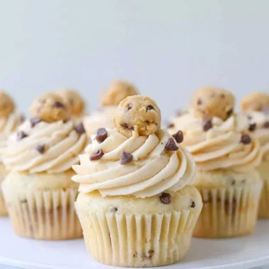 Delicious Cookie Dough Cupcakes topped with cookie dough frosting and chocolate chips