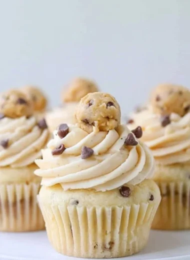 Delicious Cookie Dough Cupcakes topped with cookie dough frosting and chocolate chips