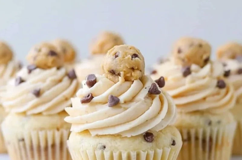 Delicious Cookie Dough Cupcakes topped with cookie dough frosting and chocolate chips
