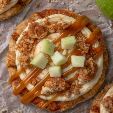Delicious Crumbl Caramel Apple Cookies with caramel drizzle and apple chunks
