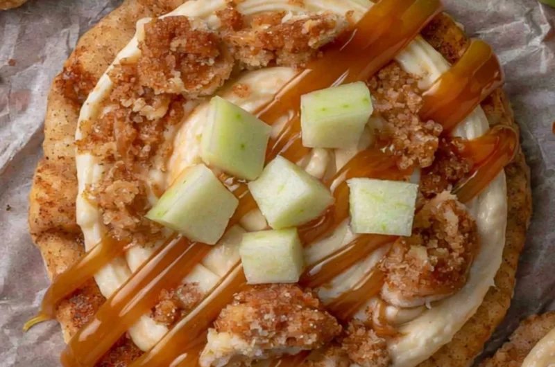 Delicious Crumbl Caramel Apple Cookies with caramel drizzle and apple chunks