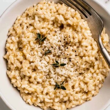 Bowl of creamy easy risotto with fresh herbs and cheese