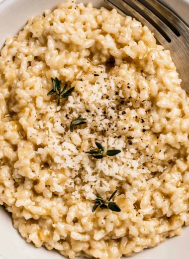Bowl of creamy easy risotto with fresh herbs and cheese