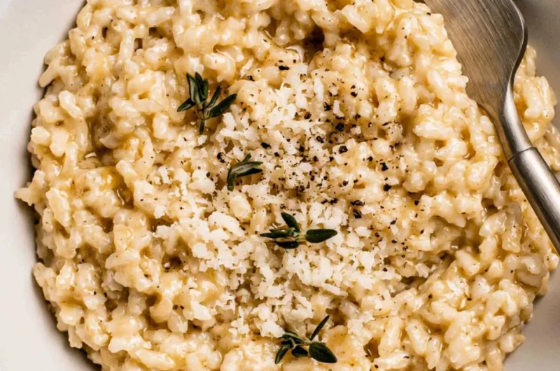 Bowl of creamy easy risotto with fresh herbs and cheese