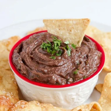 Easy Vegan 5-Minute Black Bean Dip served in a bowl with fresh herbs