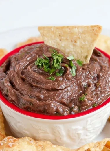 Easy Vegan 5-Minute Black Bean Dip served in a bowl with fresh herbs