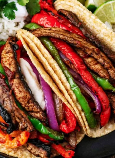 Plate of Portobello vegan fajitas with colorful peppers and onions