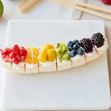 Rainbow Fruit Banana Sushi with colorful fruits on a banana base