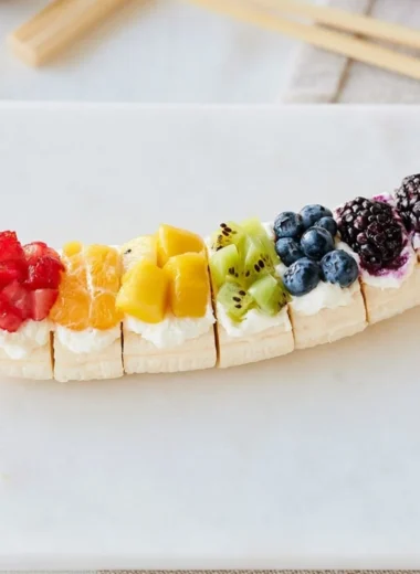 Rainbow Fruit Banana Sushi with colorful fruits on a banana base