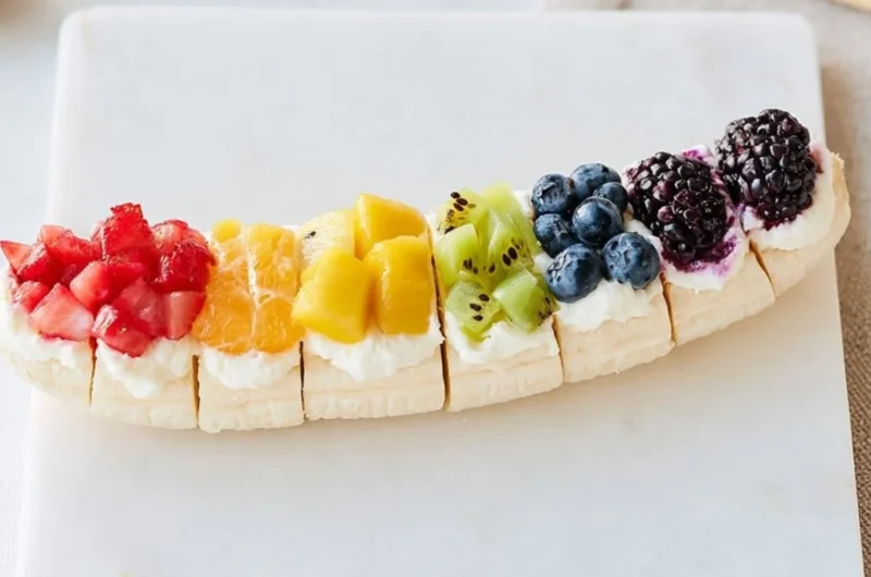 Rainbow Fruit Banana Sushi with colorful fruits on a banana base